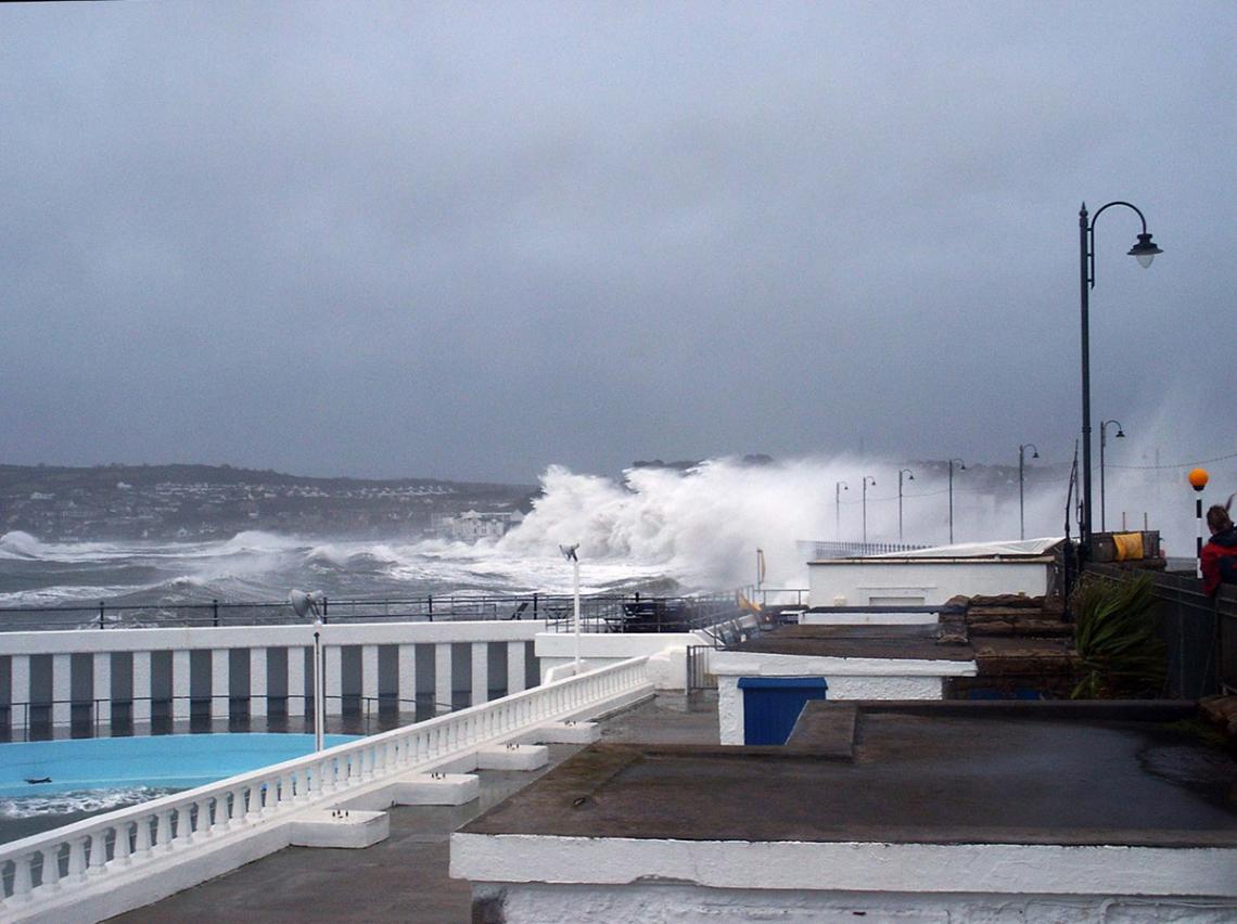 Waves crash over Penzance Promenade